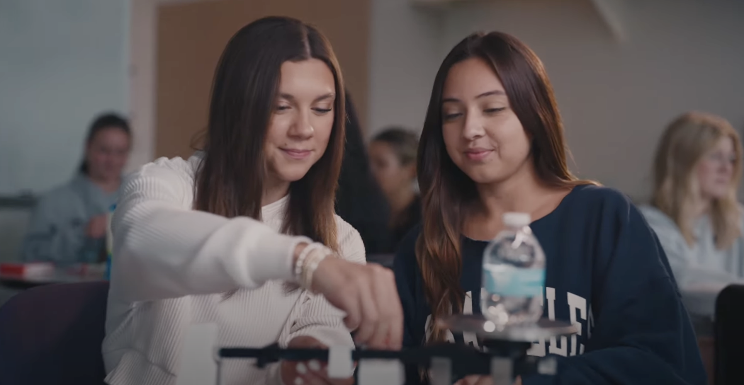 two students conducting science experiment