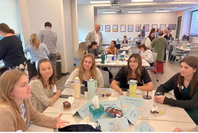 students discussing at table
