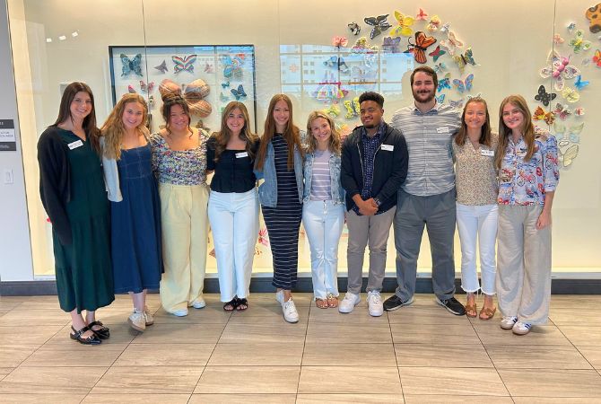 students smiling at museum