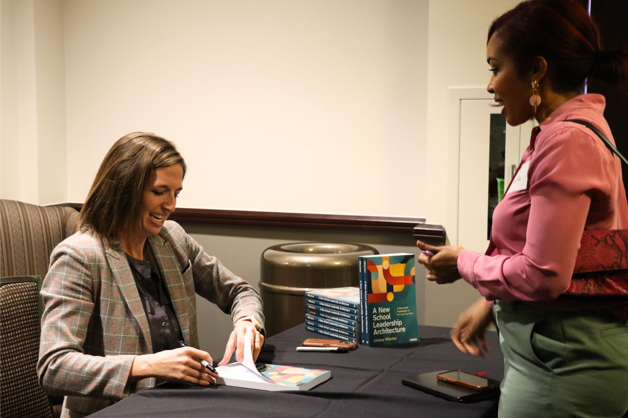 Dr. Lindsay Whorton signing copies of her new book for TCU students and faculty