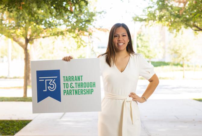 TCU CAC Senior Adviser Valerie Gonzalez holds up a Tarrant To & Through sign