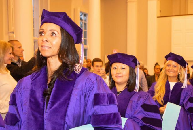 doctoral students at hooding ceremony 2018