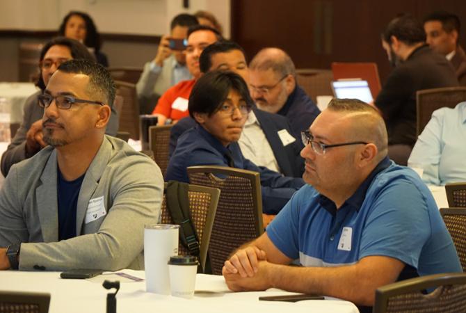 conference participants looking attentively